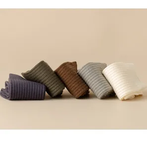 Details of men's thermal wool ribbed crew socks in assorted colors, soft knit texture.