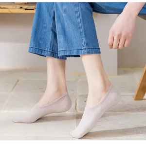 Comfortable women low-cut boat socks with cute cartoon bear detail, close-up view.