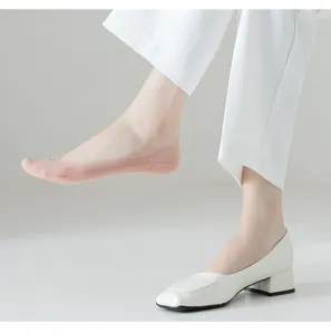 Closeup detail of women summer thin pink invisible boat socks worn with shoes.