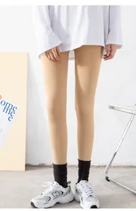 Detailed view of women's warm fleece lined flesh colored thermal tights for winter.