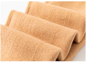 Detailed view of thick fleece lined thermal leggings fabric, soft and warm texture.