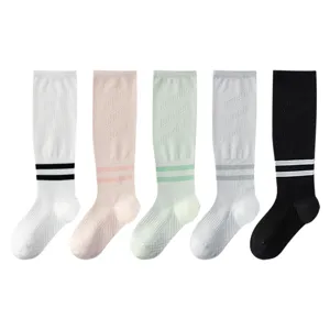 Women breathable long sports socks, knee high athletic socks for fitness, running, and yoga.