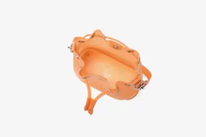 Close-up detail showing the spacious interior and drawstring of orange TPU bucket bag