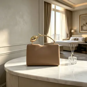 Elegant khaki evening clutch featuring a creative gold rose flower branch handle design