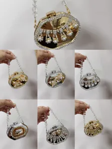 Detailed view of elegant acrylic evening bags with pearls and rhinestone tassels