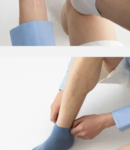 Detailed shot of men's breathable pure cotton short socks in light blue with ribbed design.