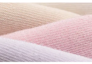 Close-up detail of soft breathable cotton socks fabric texture, fine knit, pastel colors.