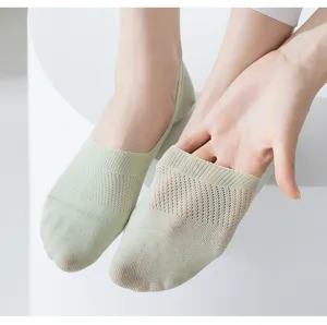 Detail view of breathable mesh summer thin low cut invisible socks in light green color.