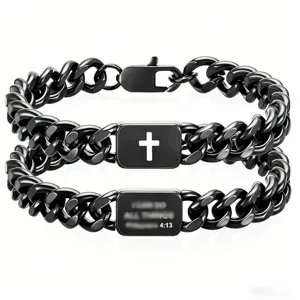 Detailed view of two black stainless steel Cuban link bracelets with cross and scripture.