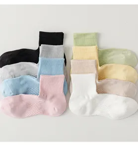 Detailed shot of breathable mesh short socks in various colors, soft cotton fabric for summer.