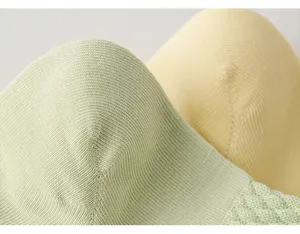 Close-up detail of breathable cotton mesh socks showing fine knit texture and soft fabric quality.