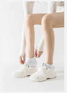 White athletic short socks for women, breathable mesh running socks, comfortable fit.