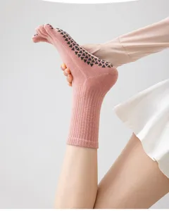 Non-slip five-toe yoga socks for women, professional cotton pilates socks with grip soles.