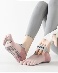 Non-slip five toe yoga socks with straps for pilates, fitness, indoor sports and training.