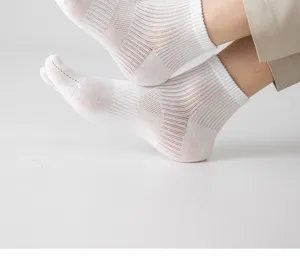 Detailed view of men's breathable mesh split-toe socks, comfortable cotton fabric close-up.