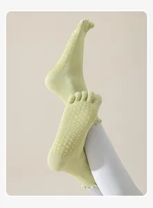 Women's non-slip five toe grip yoga socks with silicone dots for comfortable fitness workouts.