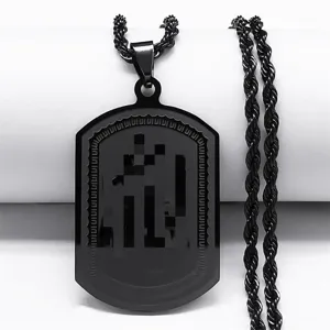 Close-up detail of black stainless steel dog tag necklace with Arabic etched pattern.