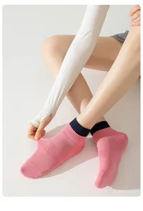 Detailed view of women's breathable cotton short athletic socks with contrast ribbed cuffs.