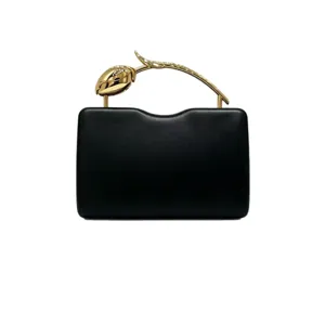 Elegant black dinner clutch bag featuring a creative gold rose flower stem handle.