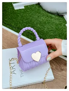 Close-up of mini purple jelly bag with gold heart lock and chain strap