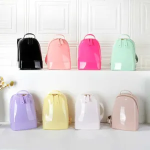 Set of 8 mini glossy PVC backpacks in vibrant candy colors for girls with top handles