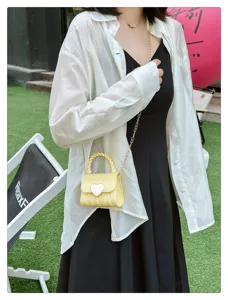 Sweet yellow mini PVC jelly bag featuring a heart-shaped lock and gold chain strap