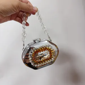 Silver metallic octagonal box clutch evening bag with amber crystal wreath and beaded strap