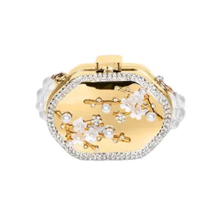 Elegant luxury gold metal box evening clutch featuring floral pearl accents and clear beaded strap