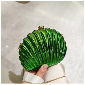 Detailed view of a shiny green shell-shaped clutch bag with a gold chain strap