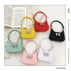 Vibrant PVC jelly bags with silver bowknot accents in multiple colors for women