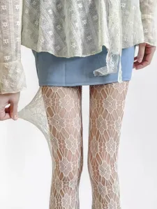 Women sexy white lace hollow pantyhose elastic fishnet tights detail view showcase product.