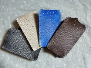 Detailed view of sparkly rhinestone fishnet stockings in various colors, stylish mesh tights.