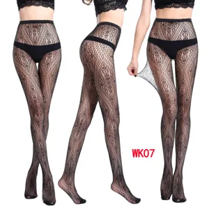Detailed view of black floral lace fishnet tights showing elastic stretch and hollow design.