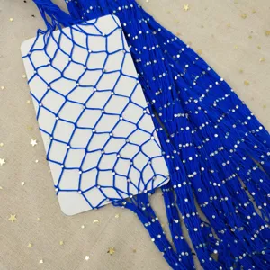 Detailed close-up of blue rhinestone fishnet tights, showcasing sparkling crystal mesh details.