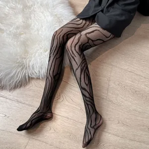 Detailed shot of women's fashion abstract patterned fishnet tights, slim fit and stretchy hosiery.
