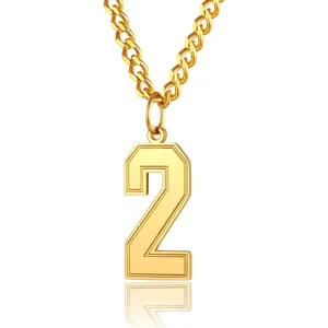 Close-up of gold stainless steel number 2 pendant necklace with a polished finish