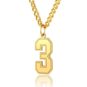 Macro view of gold-plated stainless steel number 3 pendant on a chunky curb chain