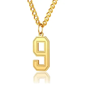 Close-up detail of a minimalist gold stainless steel number 9 pendant necklace