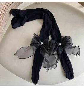Collants noirs pour enfants avec noeuds transparents, details mignons en gros plan