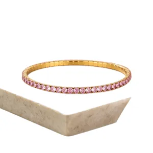 Minimalist gold-plated stainless steel stretch bracelet with pink cubic zirconia stones