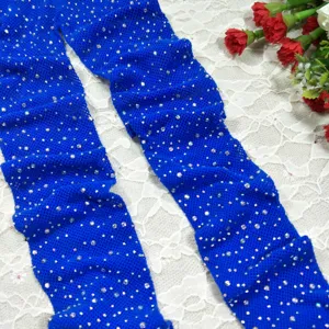 Blue rhinestone fishnet tights for women, sparkling crystal mesh stockings for fashion.