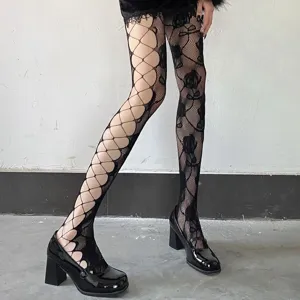 Detailed view of women asymmetric fishnet tights with unique cutout and rose patterns.