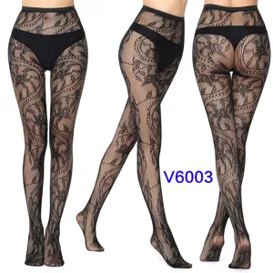 Sexy black floral fishnet tights featuring intricate patterns, detail view of pantyhose.