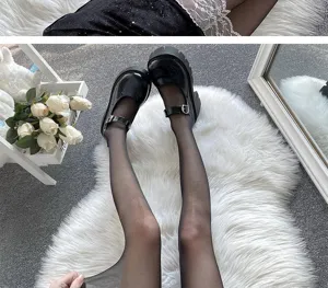 Close-up detail of sheer black pantyhose tights paired with platform Mary Jane shoes, soft furry rug background.