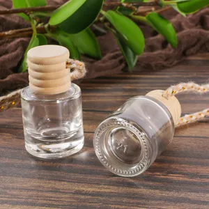 Clear glass car perfume bottle hanging pendant with wooden cap and rope for essential oil diffusers.