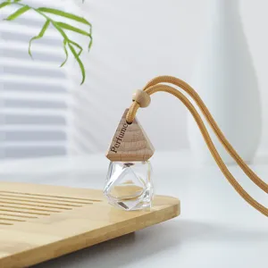 Frasco de perfume de coche de vidrio diamante transparente con tapa de madera y cuerda.