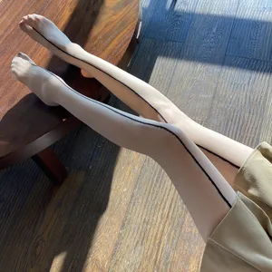 Detailed view of sheer pantyhose featuring a stylish back seam design and smooth fit.