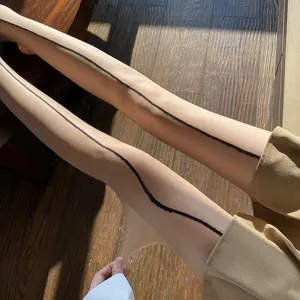 Sheer ultra-thin nude pantyhose with black back seam detail, sexy translucent hosiery.