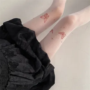 Sheer white flesh-tone stockings featuring cute red butterfly and star tattoo prints for women.