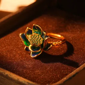 Detailed macro shot of vintage lotus ring with vibrant green and blue enamel petals